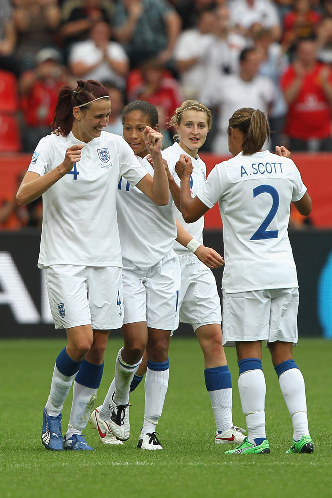 Jill Scott (left) and Alex Scott (right) celebrate the former's goal against France at the 2011 FIFA Women's World Cup.
